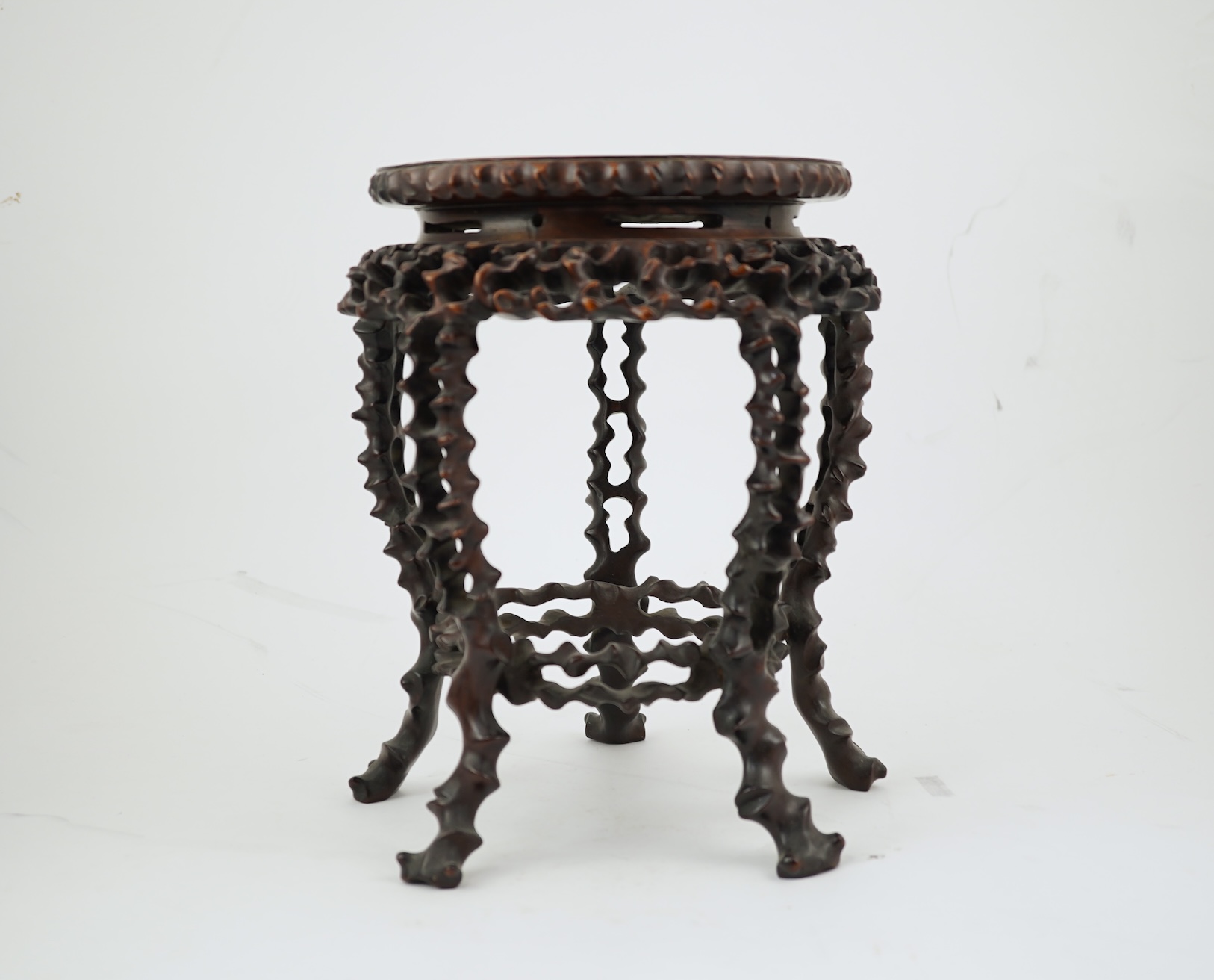 A Chinese hardwood scholar’s stand, carved in imitation of rootwood, early 20th century